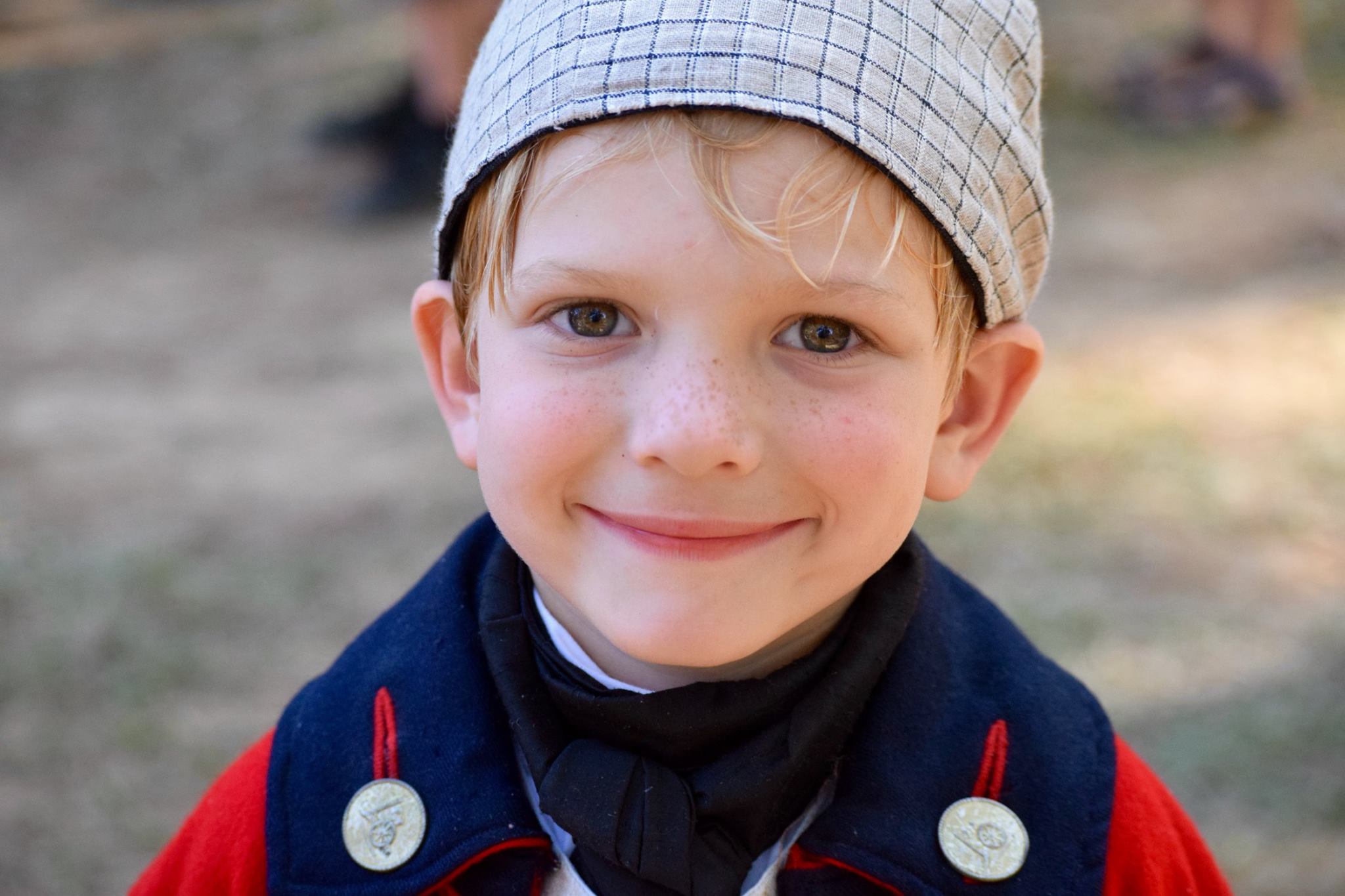 A young visitor in historical clothing at the park